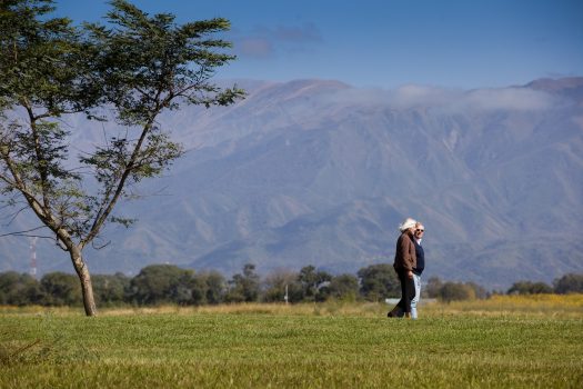 old couple walking through the garden