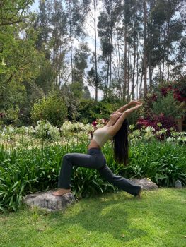 woman practising yoga in the garden