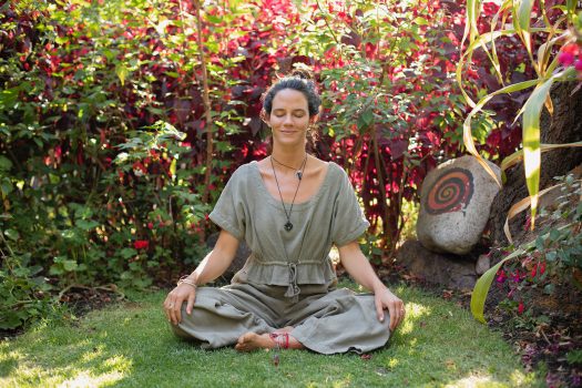 woman practicing yoga during sound ceremony